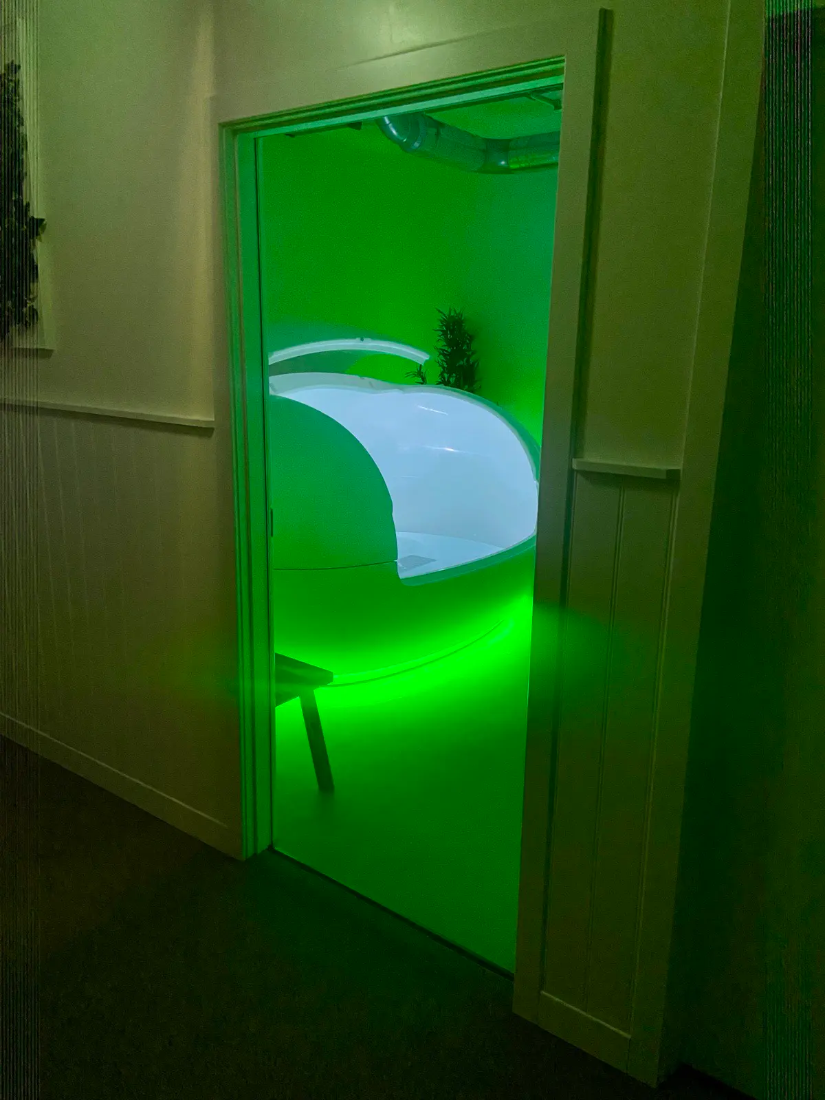 A private float room with an illuminated Orbit pod